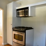 pantry, stove and refrigerator to the right.