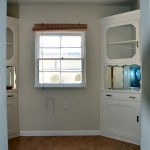 From the kitchen you walk into a breakfast nook with a built-in ironing board and milkman pass through under the window.