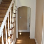 From the dining room you walk back into the entry hall and look to the right to the hall.