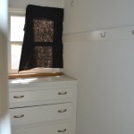 Back in the room is a closet with built-in drawers, a window and a cedar-lined closet.