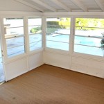 the recreation room, soon to be my office. It has a beautiful view of the backyard, pool and fireplace.